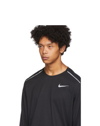 schwarzes bedrucktes Langarmshirt von Nike