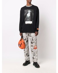 schwarzes bedrucktes Langarmshirt von Heron Preston