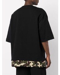 schwarzes bedrucktes T-Shirt mit einem Rundhalsausschnitt von Comme des Garcons Homme