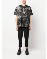 schwarzes bedrucktes T-Shirt mit einem Rundhalsausschnitt von Comme Des Garcons Homme Plus