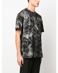 schwarzes bedrucktes T-Shirt mit einem Rundhalsausschnitt von Comme Des Garcons Homme Plus