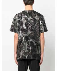 schwarzes bedrucktes T-Shirt mit einem Rundhalsausschnitt von Comme Des Garcons Homme Plus