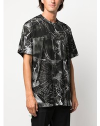 schwarzes bedrucktes T-Shirt mit einem Rundhalsausschnitt von Comme Des Garcons Homme Plus