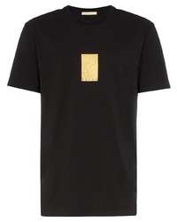 schwarzes bedrucktes T-Shirt mit einem Rundhalsausschnitt von FUTU