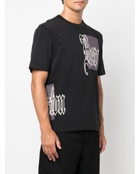 schwarzes bedrucktes T-Shirt mit einem Rundhalsausschnitt von Heron Preston