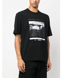 schwarzes bedrucktes T-Shirt mit einem Rundhalsausschnitt von Heron Preston