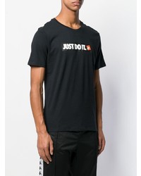 schwarzes bedrucktes T-Shirt mit einem Rundhalsausschnitt von Nike