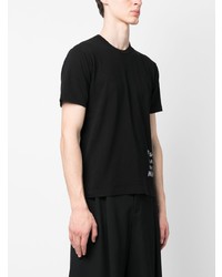 schwarzes bedrucktes T-Shirt mit einem Rundhalsausschnitt von Black Comme Des Garçons