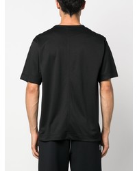 schwarzes bedrucktes T-Shirt mit einem Rundhalsausschnitt von Calvin Klein