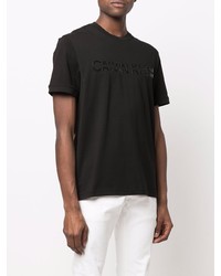 schwarzes bedrucktes T-Shirt mit einem Rundhalsausschnitt von Calvin Klein