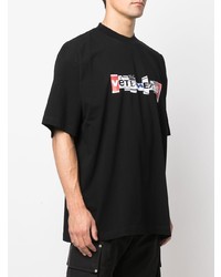 schwarzes bedrucktes T-Shirt mit einem Rundhalsausschnitt von Vetements