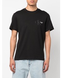 schwarzes bedrucktes T-Shirt mit einem Rundhalsausschnitt von Calvin Klein Jeans