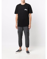 schwarzes bedrucktes T-Shirt mit einem Rundhalsausschnitt von Stussy