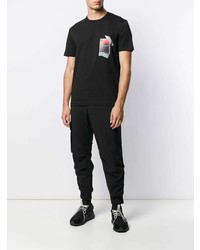 schwarzes bedrucktes T-Shirt mit einem Rundhalsausschnitt von Les Hommes Urban