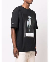 schwarzes bedrucktes T-Shirt mit einem Rundhalsausschnitt von Heron Preston