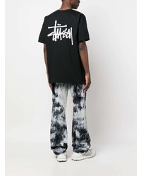 schwarzes bedrucktes T-Shirt mit einem Rundhalsausschnitt von Stussy