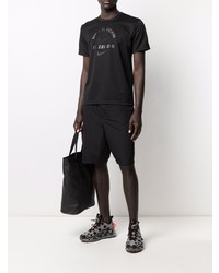 schwarzes bedrucktes T-Shirt mit einem Rundhalsausschnitt von Black Comme Des Garçons