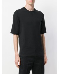 schwarzes bedrucktes T-Shirt mit einem Rundhalsausschnitt von Reebok
