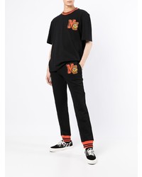 schwarzes besticktes T-Shirt mit einem Rundhalsausschnitt von Moschino