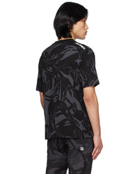 schwarzes Camouflage T-Shirt mit einem Rundhalsausschnitt von AAPE BY A BATHING APE