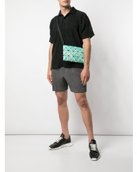 schwarzes Polohemd von Homme Plissé Issey Miyake