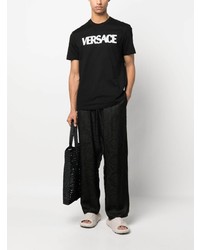 schwarzes T-Shirt mit einem Rundhalsausschnitt aus Netzstoff von Versace