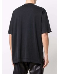 schwarzes T-Shirt mit einem Rundhalsausschnitt mit Flicken von Givenchy
