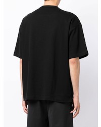 schwarzes T-Shirt mit einem Rundhalsausschnitt mit Flicken von Comme des Garcons Homme