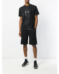 schwarzes T-Shirt mit einem Rundhalsausschnitt mit geometrischem Muster von Les Hommes Urban