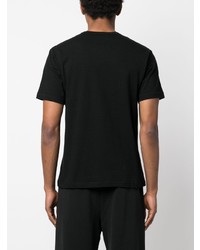 schwarzes T-Shirt mit einem Rundhalsausschnitt von Black Comme Des Garçons