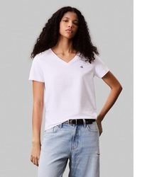 schwarzes T-Shirt mit einem V-Ausschnitt von Calvin Klein Jeans