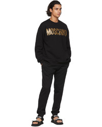 schwarzes und goldenes bedrucktes Sweatshirt von Moschino