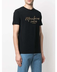 schwarzes und goldenes bedrucktes T-Shirt mit einem Rundhalsausschnitt von Moschino