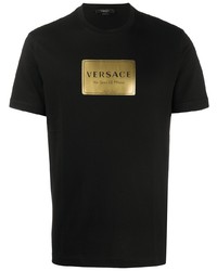 schwarzes und goldenes bedrucktes T-Shirt mit einem Rundhalsausschnitt von Versace