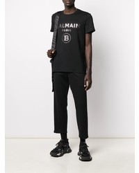 schwarzes und silbernes bedrucktes T-Shirt mit einem Rundhalsausschnitt von Balmain