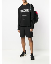 schwarzes und weißes bedrucktes Langarmshirt von Moschino