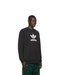 schwarzes und weißes bedrucktes Sweatshirt von adidas Originals