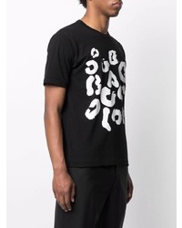 schwarzes und weißes bedrucktes T-Shirt mit einem Rundhalsausschnitt von Black Comme Des Garçons