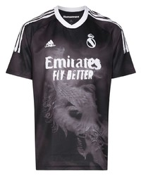schwarzes und weißes bedrucktes T-Shirt mit einem Rundhalsausschnitt von Adidas By Pharrell Williams