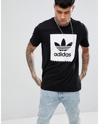 schwarzes und weißes bedrucktes T-Shirt mit einem Rundhalsausschnitt von Adidas Skateboarding