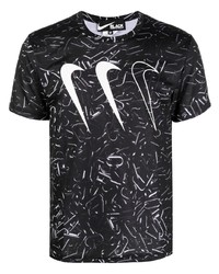 schwarzes und weißes bedrucktes T-Shirt mit einem Rundhalsausschnitt von Black Comme Des Garçons
