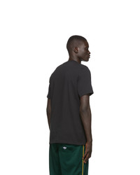 schwarzes und weißes bedrucktes T-Shirt mit einem Rundhalsausschnitt von adidas Originals