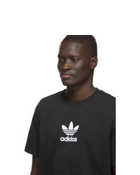 schwarzes und weißes bedrucktes T-Shirt mit einem Rundhalsausschnitt von adidas Originals