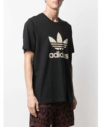 schwarzes und weißes bedrucktes T-Shirt mit einem Rundhalsausschnitt von adidas