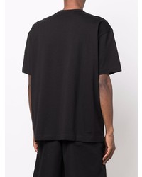 schwarzes und weißes bedrucktes T-Shirt mit einem Rundhalsausschnitt von Comme Des Garcons SHIRT