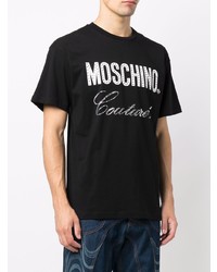 schwarzes und weißes bedrucktes T-Shirt mit einem Rundhalsausschnitt von Moschino