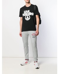 schwarzes und weißes bedrucktes T-Shirt mit einem Rundhalsausschnitt von Love Moschino