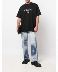 schwarzes und weißes bedrucktes T-Shirt mit einem Rundhalsausschnitt von Vetements