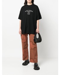 schwarzes und weißes bedrucktes T-Shirt mit einem Rundhalsausschnitt von Vetements