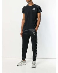 schwarzes und weißes bedrucktes T-Shirt mit einem Rundhalsausschnitt von Marcelo Burlon County of Milan